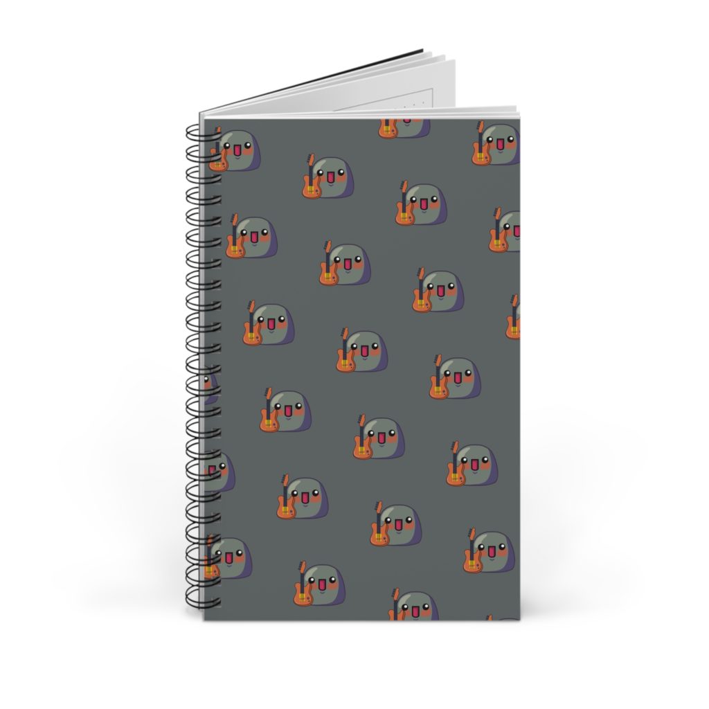 Carnet à spirale avec une pattern de Kyous tenant une guitare